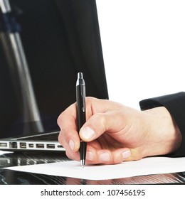 A Yuong Business Man Writing In A Paper