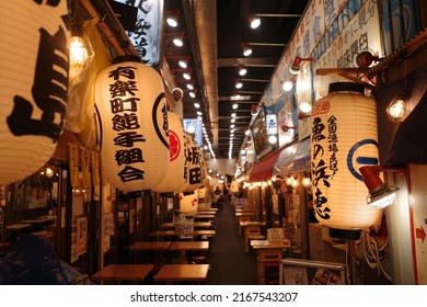 Yurakucho, Tokyo, Japan - June 10 2022: A food alley packed with izakaya restaurants and bars in Yurakucho.