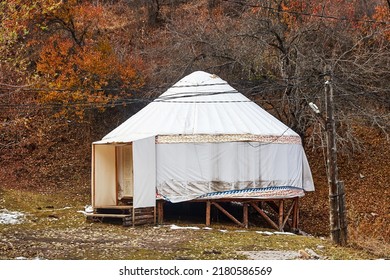 Yurt Is Mounted On Wooden Deck. Nomadic Culture . Glamping In The Central Asia National Style