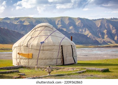 Yurt. National Old House Of The Peoples Of Kyrgyzstan And Asian Countries. National Housing. Yurts On The Background Of Green Meadows And Highlands. Yurt Camp For Tourists.