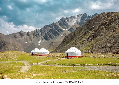 Yurt. National Old House Of The Peoples Of Kyrgyzstan And Asian Countries. National Housing. Yurts On The Background Of Green Meadows And Highlands. Yurt Camp For Tourists.