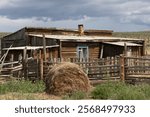 Yurt and old wooden house. Cattlemen