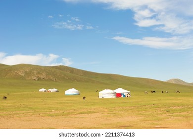 Yurts And Horses In Mongolian Steppe