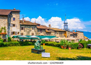 YVOIRE, France, JULY 21, 2017: Statue Of Voltaire In French City Yvoire
