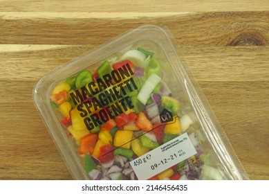 Zaandam, The Netherlands - December 6, 2021: Package Of Dutch Albert Heijn Pre Cut Macaroni And Spaghetti Vegetables On A Kitchen Table.