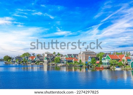 Zaandijk, Netherlands. Panorama of traditional dutch houses at the Zaan river in Zaandijk, Netherlands.