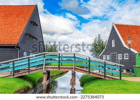 Zaandijk, Netherlands. Panorama of traditional dutch houses at the Zaan river in Zaandijk, Netherlands.