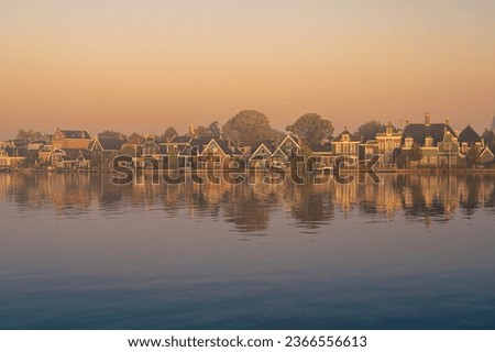 Zaandijk, Netherlands. Panorama of traditional dutch houses at the Zaan river in Zaandijk, Netherlands.
