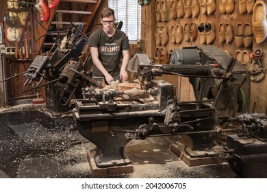 Zaanse Schans, Netherlands - February 25: Manufacturing facility of Klompen, man works on the machine. Production of traditional Dutch shoes