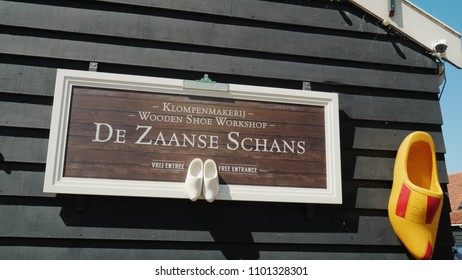 Zaanse Schans, Netherlands, May 2018: The exhibition of handmade shoe manufactory in Zaans Hans. Footwear made of wood - cloppen, a popular souvenir from Holland