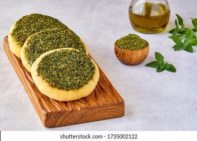 Zaatar manakeesh on wooden board  . Close up, copy space - Powered by Shutterstock