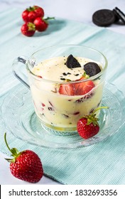 Zabaglione with the addition of strawberries and chocolate cookies