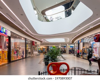 Zabrze. Poland 8 Maj 2021. Shopping center building background in Platan City Center. People shopping in modern commercial mall center. Interior of retail centre store in soft focus