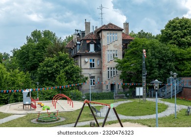 Zabrze, Poland - June 19, 2023: Park 12C in Zabrze near Queen Luiza Adit. Educational zone and playground. Playground toys stylized as mining infrastructure devices.