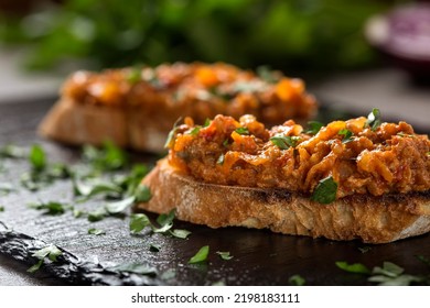 Zacusca - Romanian vegetable spread, with fish, roasted eggplant, onions tomato paste, and roasted red peppers - Shutterstock ID 2198183111