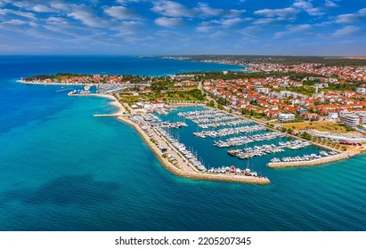 Zadar, Croatia - Aerial view of Zadar yacht marina with sailboats, yachts, blue sky and turquoise Adriatic sea water on a sunny summer day - Shutterstock ID 2205207345