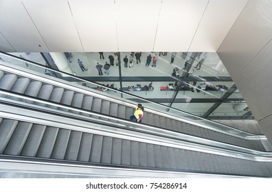 ZAGREB AIRPORT - 24 APRIL 2017: Aerial View Of Passengers Waiting In Hall, Escalators Passing.