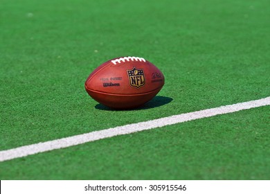 ZAGREB , CROATIA - 13 AUGUST 2015 -  Official Ball Of The NFL Football League , The Duke On Grass Turf Background , Product Shot