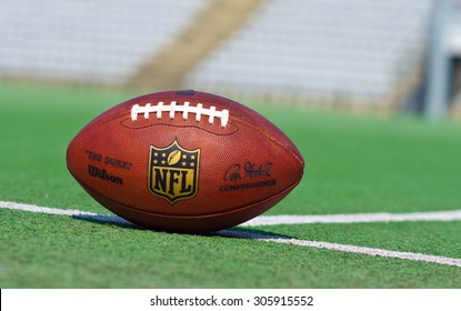 ZAGREB , CROATIA - 13 AUGUST 2015 -  official ball of the NFL football league , the Duke on grass turf background , product shot