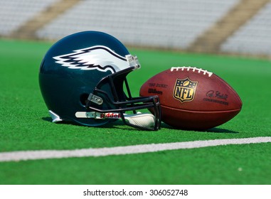 ZAGREB , CROATIA - 13 AUGUST 2015 -  Philadelphia eagles equipment , ball and helmet on the green playing field , product shot