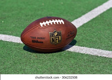 ZAGREB , CROATIA - 13 AUGUST 2015 -  Official Ball Of The NFL Football League , The Duke On Grass Turf Background , Product Shot