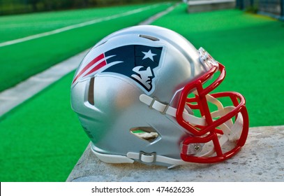 ZAGREB , CROATIA - 28 OCTOBER 2015 -  New England Patriots NFL club replica helmet at the green playing field , product shot