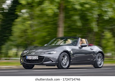 Zagreb. Croatia - April 22, 2018: A man is driving Mazda MX-5 aka Miata fast on a road. This Japanese roadster became popular in the eighties because it was affordable.