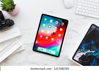 ZAGREB, CROATIA - FEBRUARY 18, 2019: Apple IPad Pro 11 Inch With Apple Pencil 2 On White Marble Background. Newly Opened IPad Pro 11 Inch And Apple Pencil 2 Surrounded By Boxes. Top View.