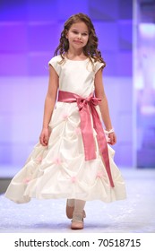 ZAGREB, CROATIA - FEBRUARY 4: Unidentified Child Fashion Model In Bridesmaid Dress On 'Wedding Days' Show, February 4, 2011 In Zagreb, Croatia.