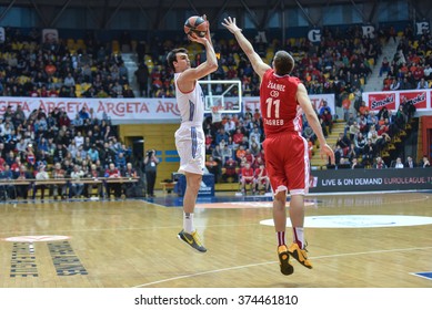 ZAGREB, CROATIA - JANUARY 21, 2016- Basketball Euroleague - Cedevita Zagreb VS Anadoplu Efes Intanbul. SARIC, DARIO (9) Three Pointer Against ZGANEC, KARLO (11).