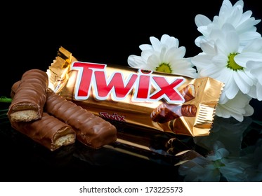 ZAGREB , CROATIA - JANUARY 24 ,2014 : Chocolate Candy Bar Twix With Flowers On The Table , Product Shot