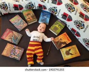 Zagreb, Croatia - January 26th, 2021: Cute Baby Boy In Costume Of Harry Potter Surrounded With Books