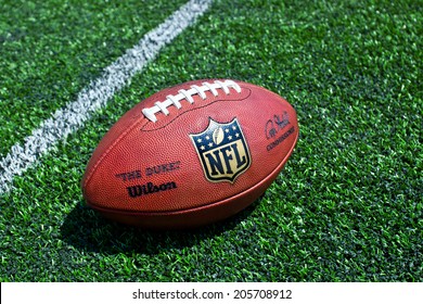 ZAGREB , CROATIA - JULY 18 ,2014 :  Official Ball Of The NFL Football League , The Duke On Grass Turf Background , Product Shot