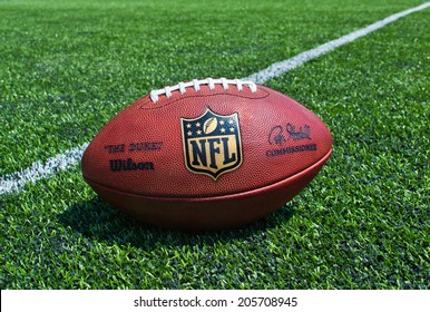 ZAGREB , CROATIA - JULY 18 ,2014 :  Official Ball Of The NFL Football League , The Duke On Grass Turf Background , Product Shot