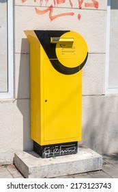 Zagreb, Croatia - June 2, 2022: Yellow mail post box of Hrvatska posta (Croatian Post) mail box of national postal operator of the Republic of Croatia.