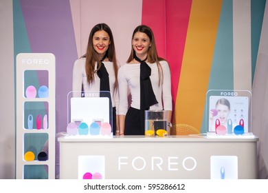 ZAGREB, CROATIA - MARCH 2, 2017: Two Hostesses Present Foreo LUNA Mini Facial Cleansing Brushes And IRIS Eye Massager At Foreo's Display