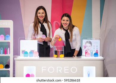 ZAGREB, CROATIA - MARCH 2, 2017: Two Hostesses Present Foreo LUNA Mini Facial Cleansing Brushes And IRIS Eye Massager At Foreo's Display