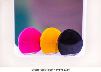 ZAGREB, CROATIA - MARCH 2, 2017: Close-up View A LUNA Mini Facial Cleansing Brush From FOREO In Magenta, Orange And Black