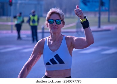 Zagreb, Croatia - March 27, 2022: Active Senior Woman Running Marathon