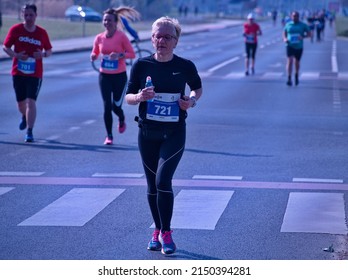 Zagreb, Croatia - March 27, 2022: Active Senior Woman Running Marathon