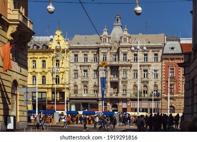 Zagreb, Croatia - March 29, 2019. Ban Jelacic Square Historical Building Facades, Street Fair Tents, Hanging Lanterns And Walking People On Sunny Spring Day. Pedestrian Area In City Center.