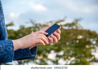 ZAGREB, CROATIA - May 19, 2014: Woman Hand Holding A Black Apple Iphone Mobile Smartphone.