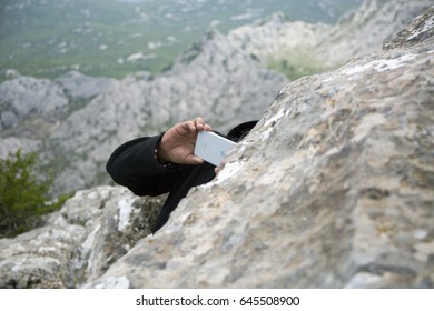 ZAGREB, CROATIA - MAY 21, 2017. - Hiker Taking Photo With Iphone From Top Of Tulove Grede, Part Of Velebit Mountain In Croatia. 