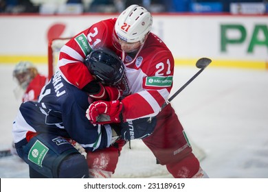 ZAGREB, CROATIA - NOVEMBER 16, 2014: KHL league - Medvescak Zagreb VS Vityaz Podolsk. PALUSHAJ Aaron (blue) and VYGLAZOV Nikita (red) fighting. 
