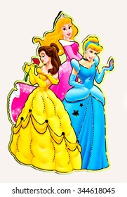 ZAGREB , CROATIA - NOVEMBER 24, 2015 :  Disney princess , Cinderella, Belle and Aurora cartoon characters from books and movies on magnetic sticker, product shot
