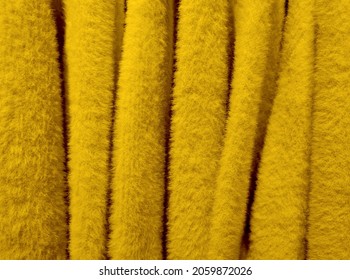 ZAGREB, CROATIA - Oct 13, 2021: Yellow Fuzzy Warm Sweater Fabric, Great For Text Overlay