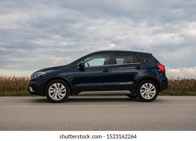 ZAGREB, CROATIA - OCTOBER 05, 2019: New Suzuki SX4 S-Cross In Dark Blue Colour On Open Road. Side View Of The Car.