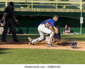 ZAGREB. CROATIA - OCTOBER 12, 2014: Match Between Baseball Club Zagreb In Blue Jersey And Olimpija In Dark Blue Jersey. Unidentified Player Slide On Home Base