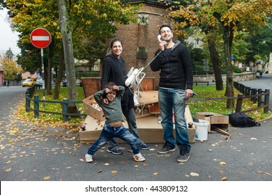 ZAGREB, CROATIA - OCTOBER 14, 2013: Roma Family Fooling Around For Camera At Garbage Dump.