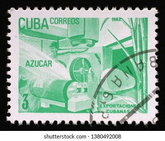 ZAGREB, CROATIA - SEPTEMBER 02, 2014: A Stamp Printed In Cuba, Shows Sugar Processing Plant, Exportaciones Cubanas, Circa 1982